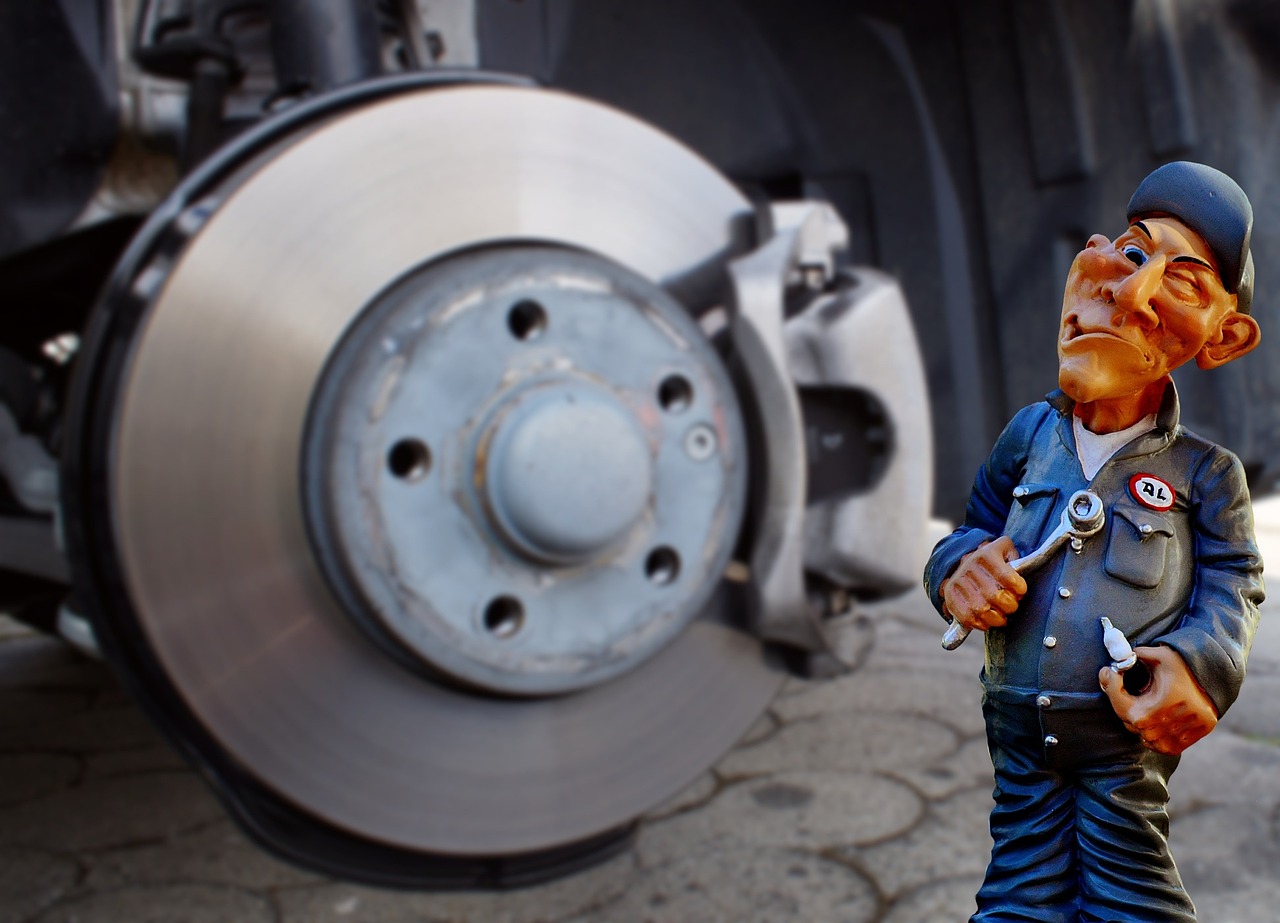 brake rotors next to a mechanic figurine
