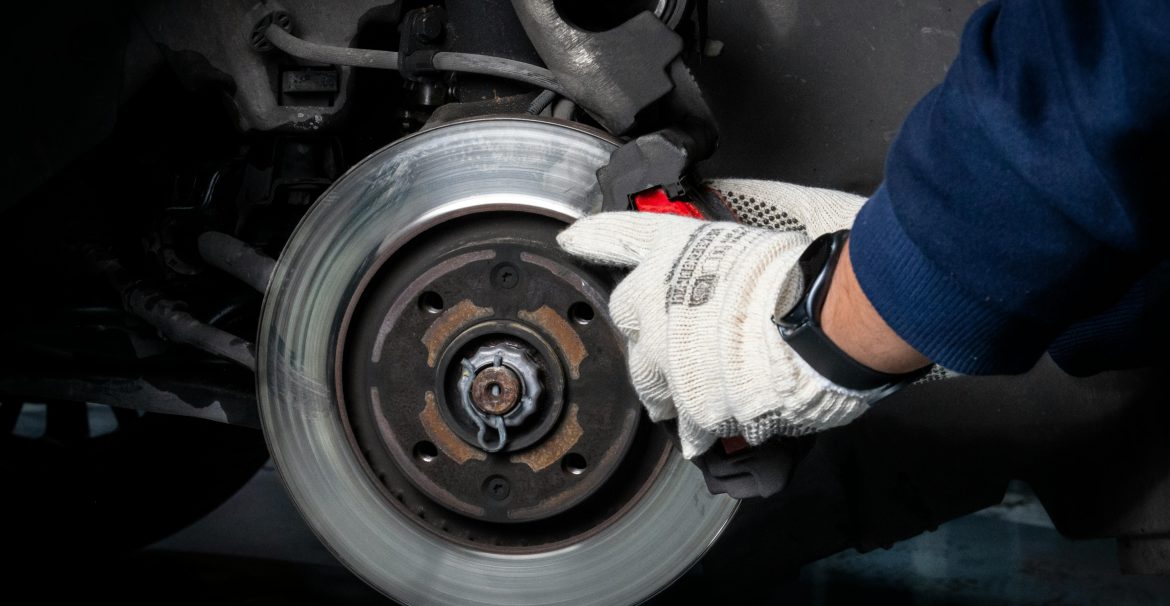 mechanic fixing a brake system