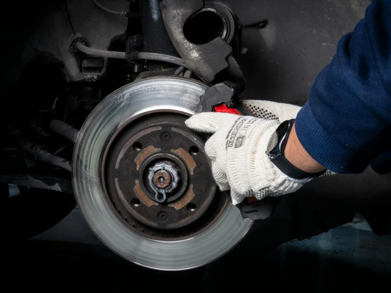 mechanic fixing a brake system
