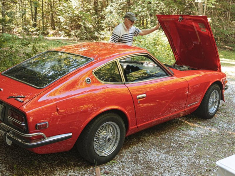 a man looking at the hood